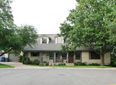 A 2-story with large covered porch